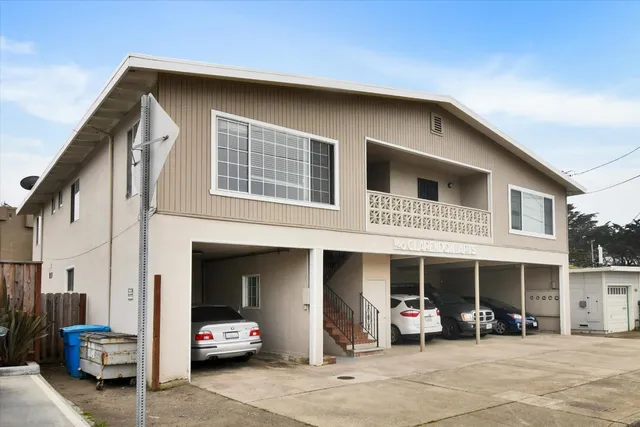 a front view of a house with a big yard