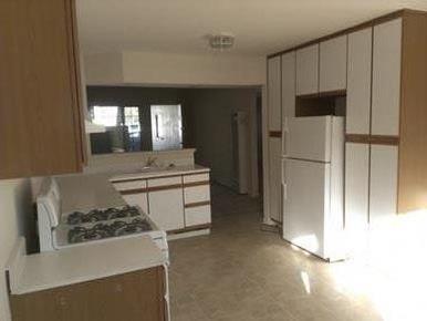 160 Clarendon Road Pacifica, CA 94044 - Photo 67 of 81 a kitchen with stainless steel appliances a stove a refrigerator and a sink