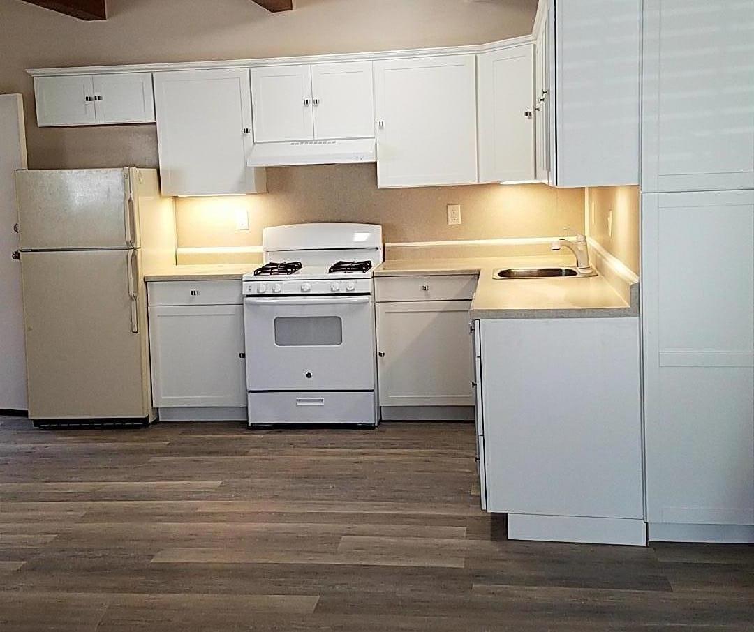 160 Clarendon Road Pacifica, CA 94044 - Photo 75 of 81 a kitchen with cabinets appliances and wooden floor