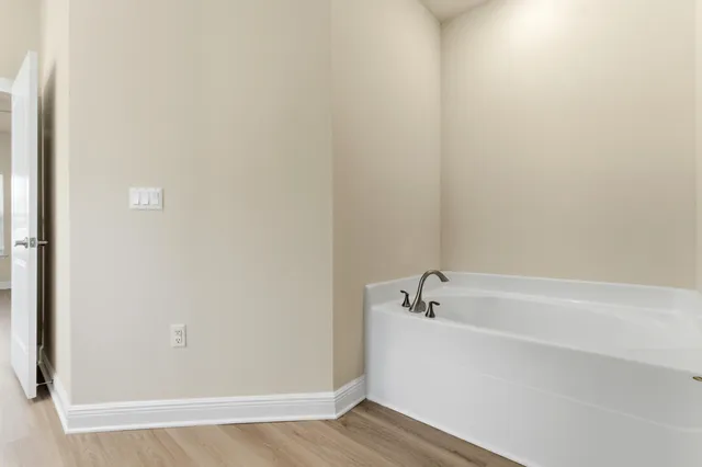 a view of a bathtub in a bathroom
