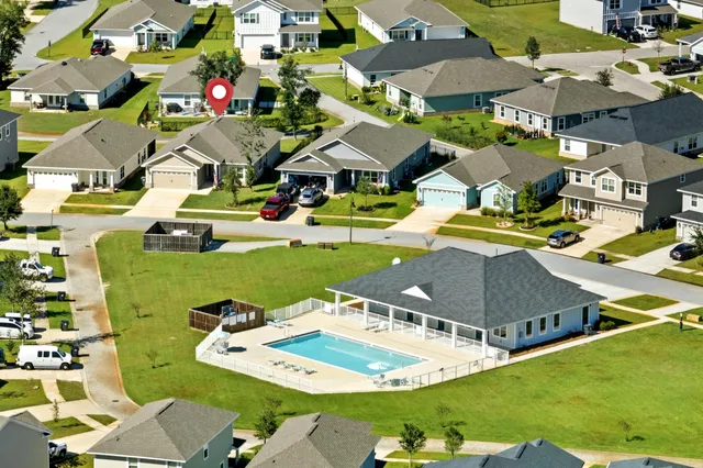 front view of a house with a swimming pool