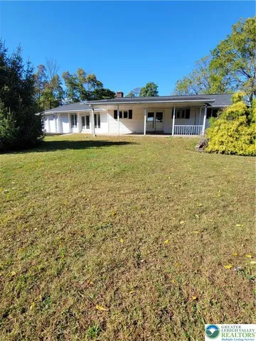 a view of a house with a garden