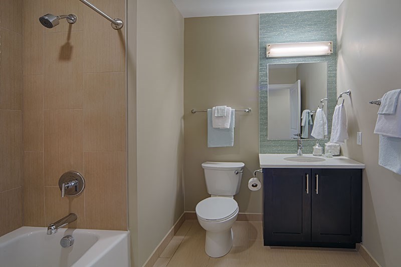 33 Rogers Street, Unit 601 Cambridge, MA 02142 - Photo 5 of 11 a bathroom with a toilet sink and mirror