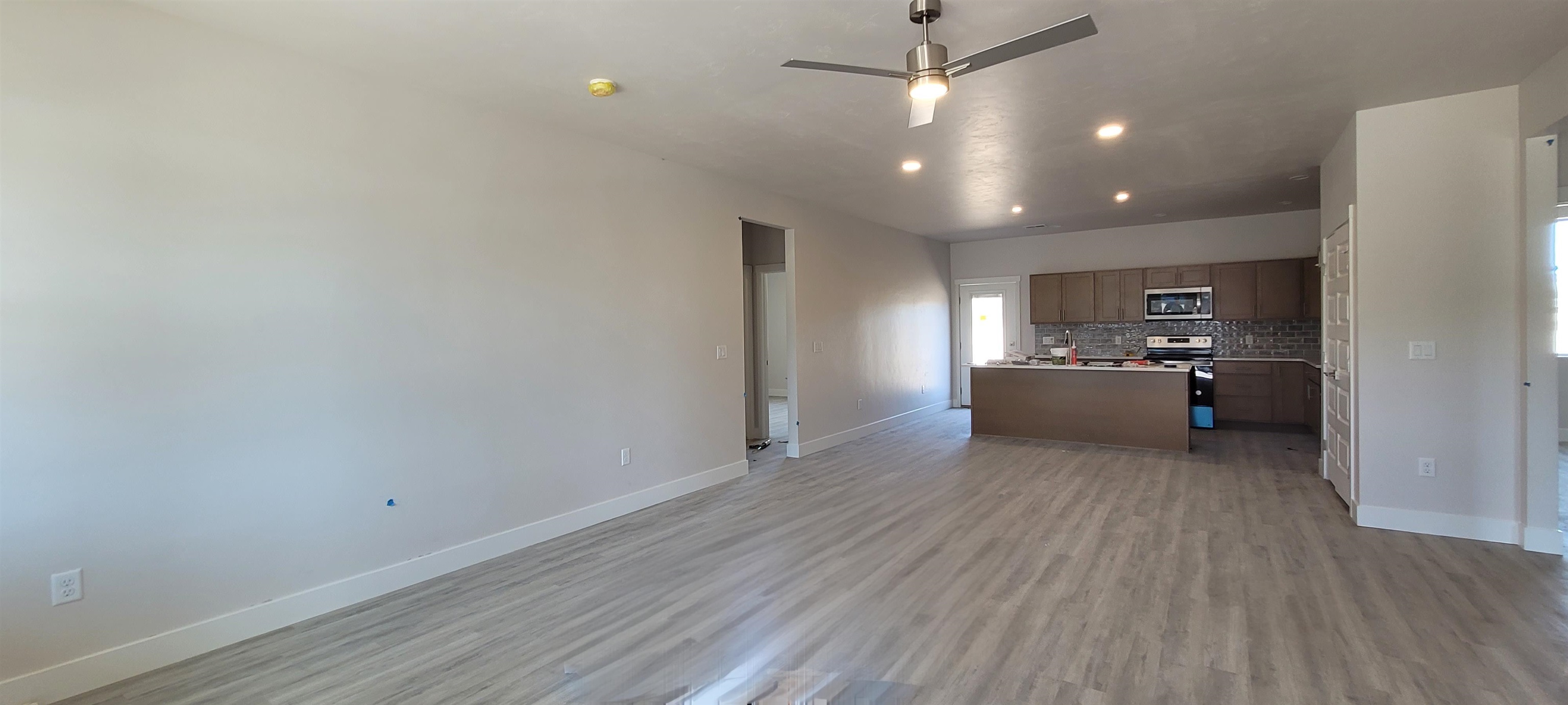 2460 Ross Road Grand Junction, CO 81505 - Photo 2 of 9 a view of a livingroom with a hardwood
