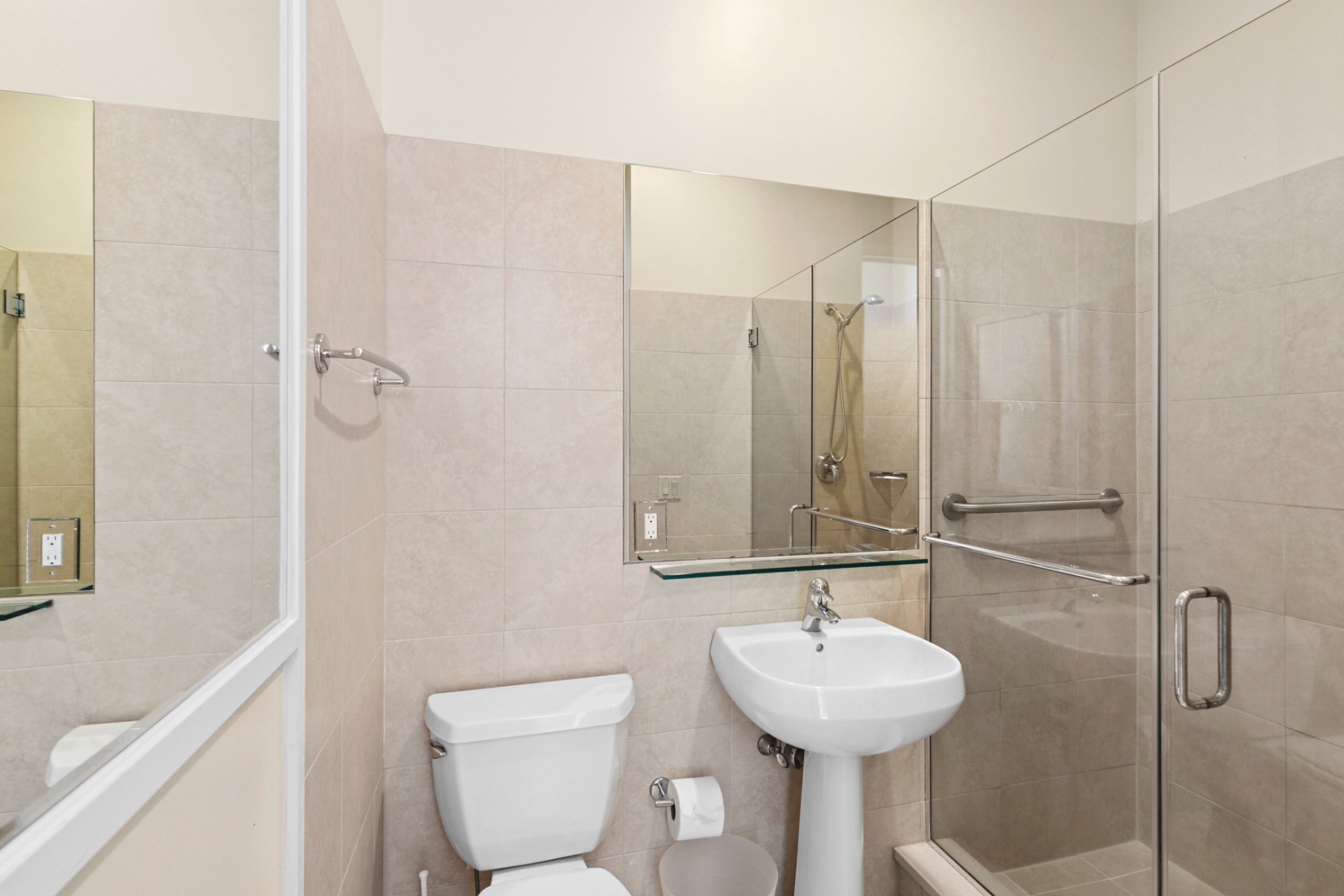 819 Dune Road Westhampton Beach, NY 11978 - Photo 9 of 18 a bathroom with a sink a toilet and a mirror