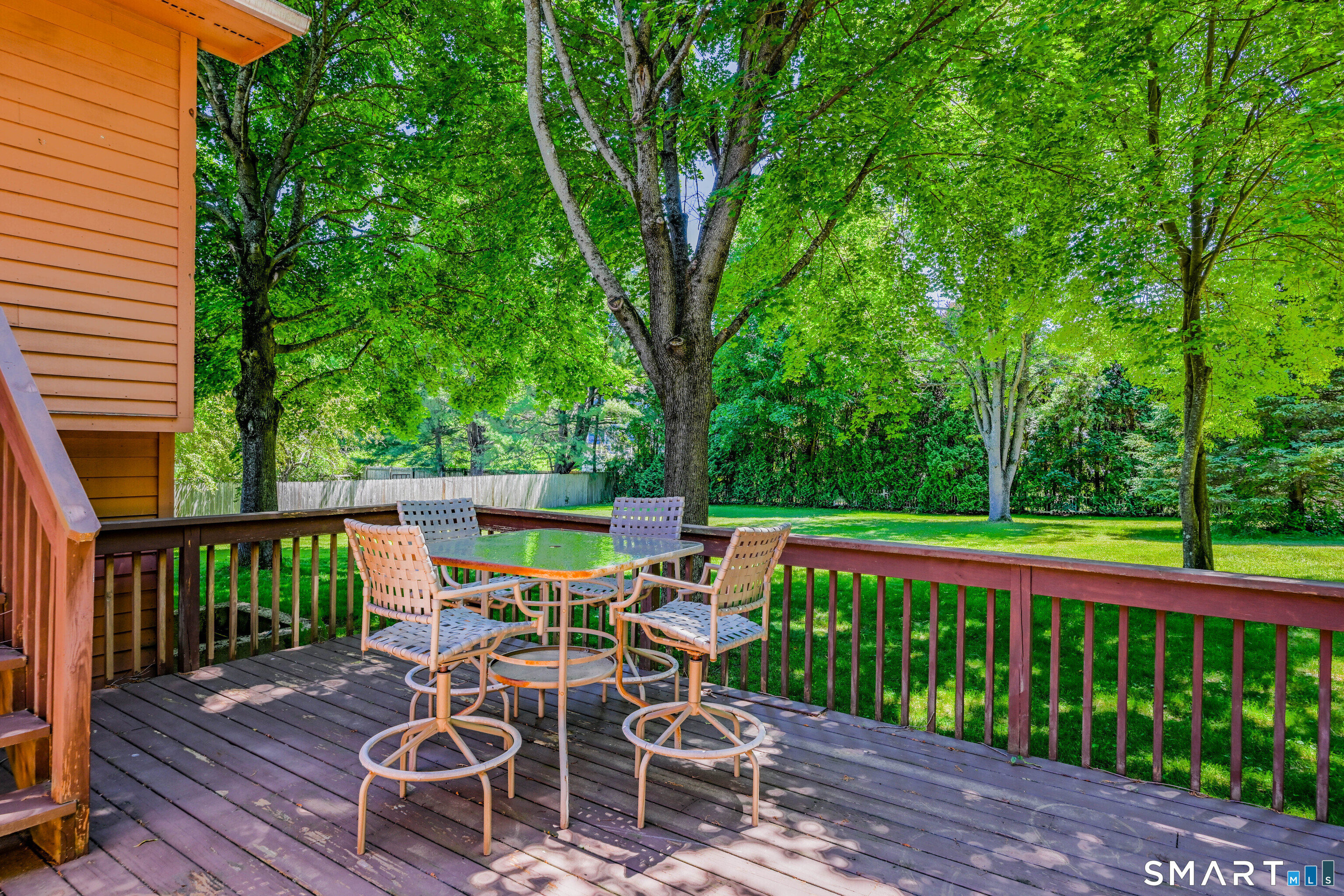 93 Court Street Cromwell, CT 06416 - Photo 29 of 38 lower deck loverlooking the fenced in yard