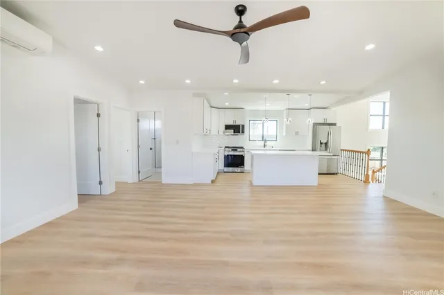 a view of a kitchen with a refrigerator and a stove