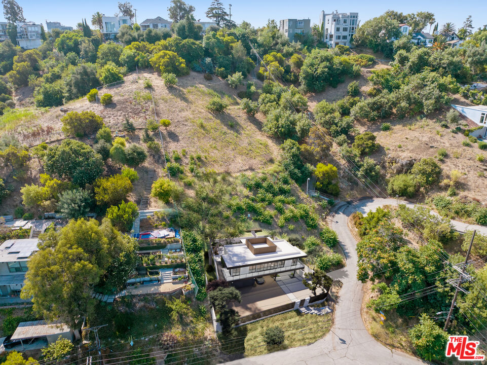 2100 Avon Street Los Angeles, CA 90026 - Photo 2 of 36 a view of a house with a backyard and sitting area