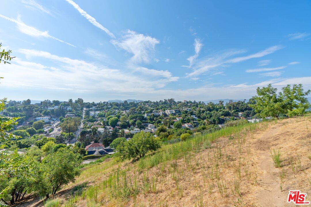 2100 Avon Street Los Angeles, CA 90026 - Photo 32 of 36 a view of a lake with houses in the back