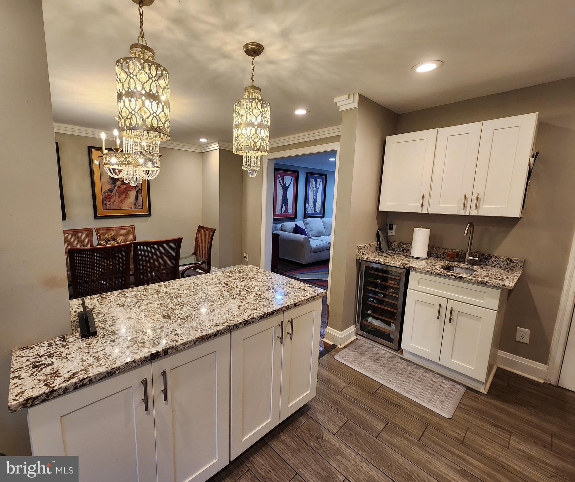 1229 Winston Avenue Baltimore, MD 21239 - Photo 2 of 19 a kitchen with stainless steel appliances granite countertop a sink stove and refrigerator