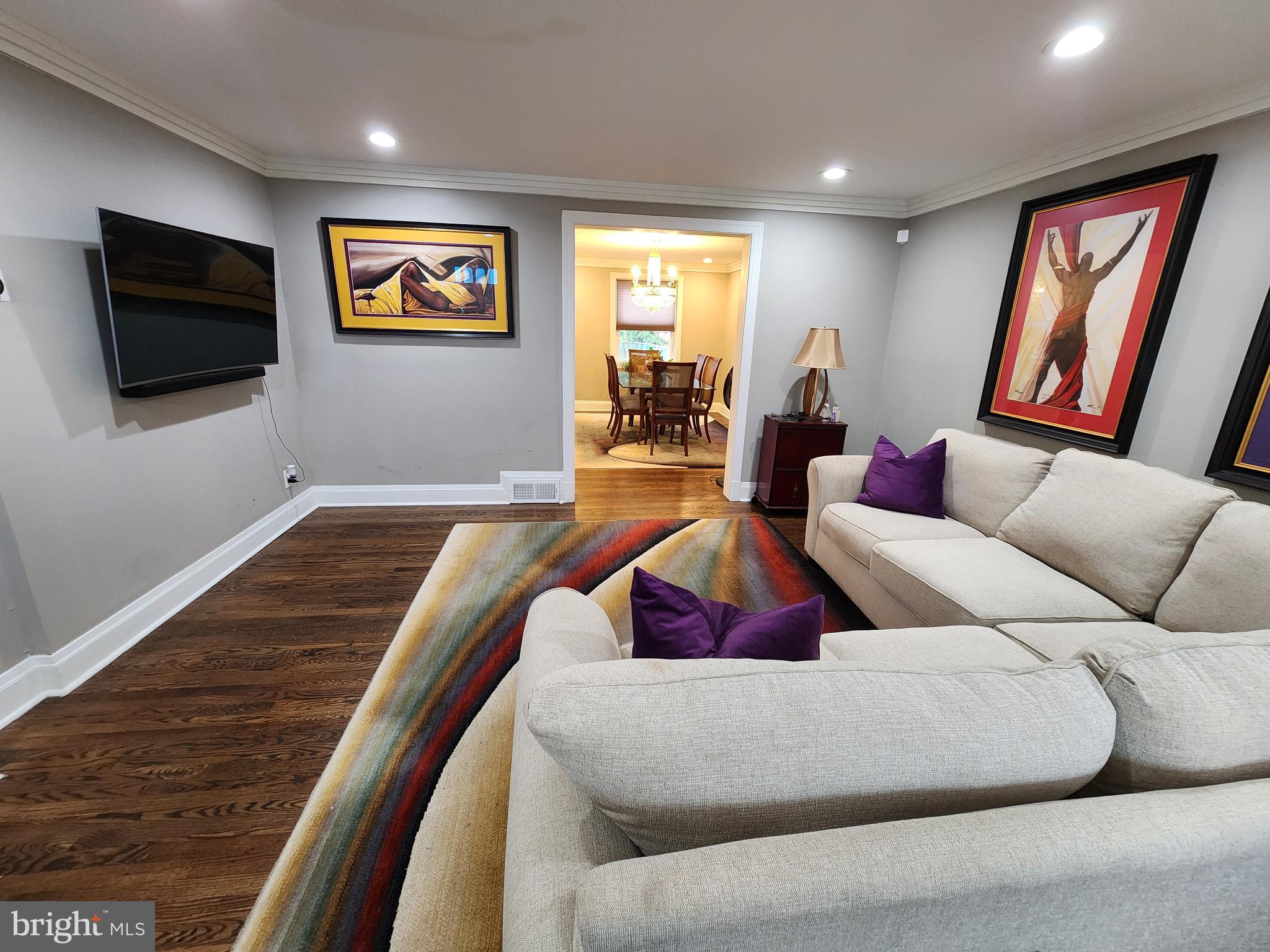 1229 Winston Avenue Baltimore, MD 21239 - Photo 8 of 19 a living room with furniture and a flat screen tv