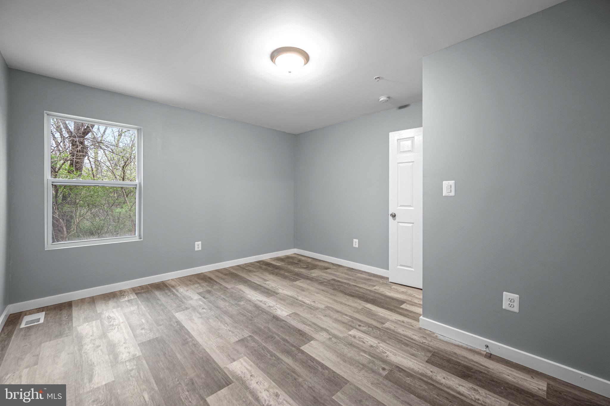 4714 Ladiesburg Road Union Bridge, MD 21791 - Photo 19 of 34 wooden floor in an empty room with a window