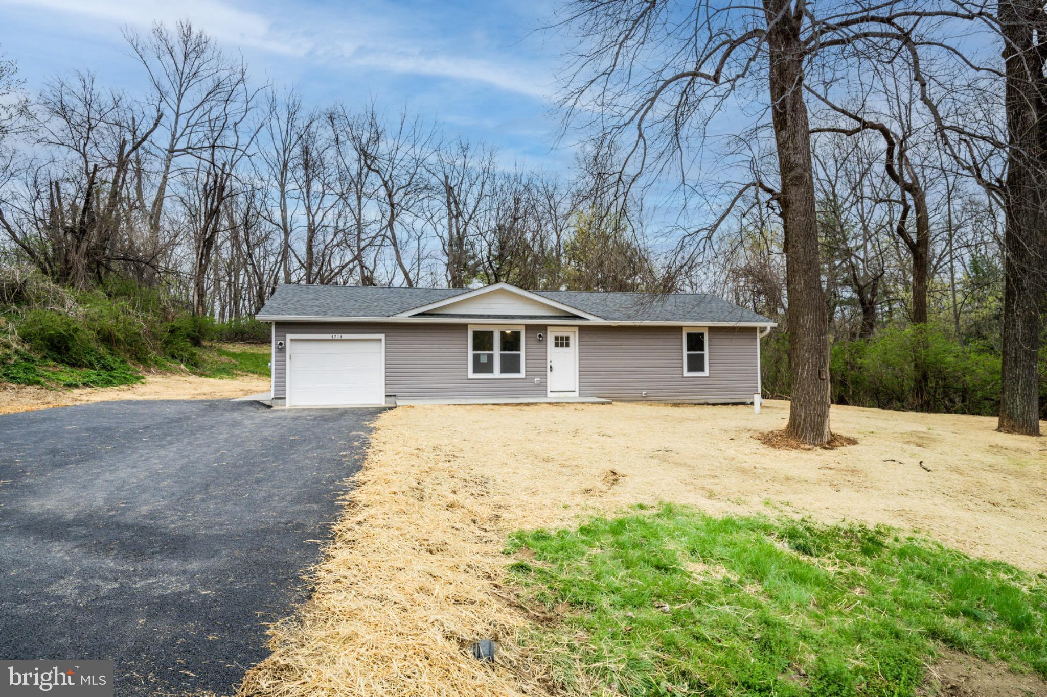 4714 Ladiesburg Road Union Bridge, MD 21791 - Photo 28 of 34 a front view of house with yard and trees in the background
