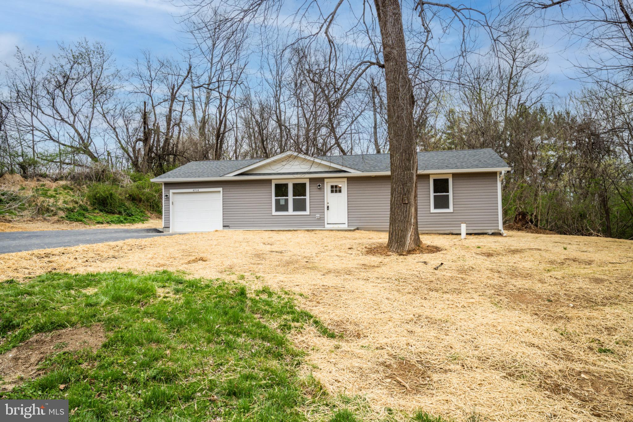4714 Ladiesburg Road Union Bridge, MD 21791 - Photo 29 of 34 a front view of a house with a yard and garage