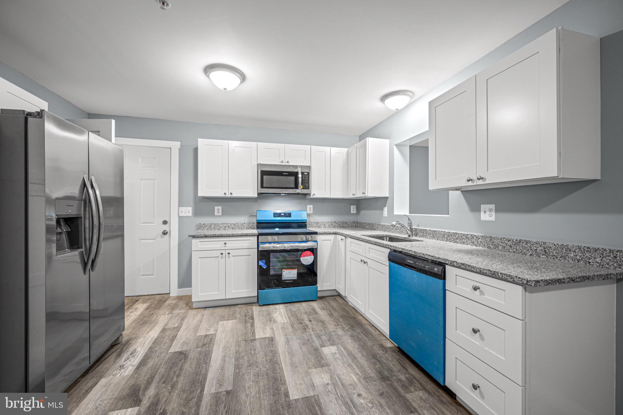 4714 Ladiesburg Road Union Bridge, MD 21791 - Photo 5 of 34 a kitchen with granite countertop a refrigerator stove top oven and sink