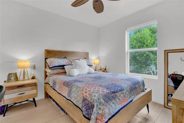 a bedroom with a bed and window