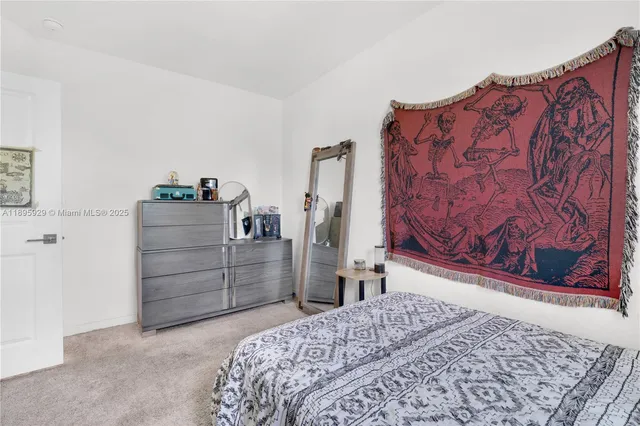 a bedroom with a bed and chair