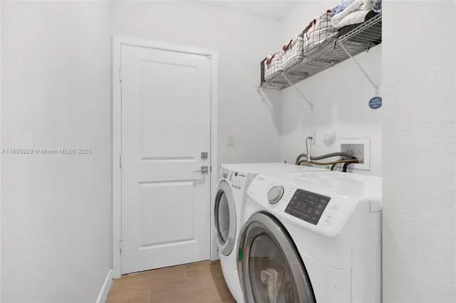 a utility room with dryer and washer