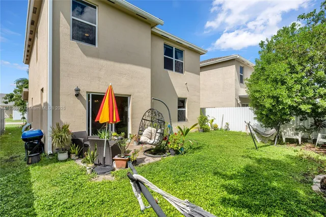 a backyard of a house with seating space