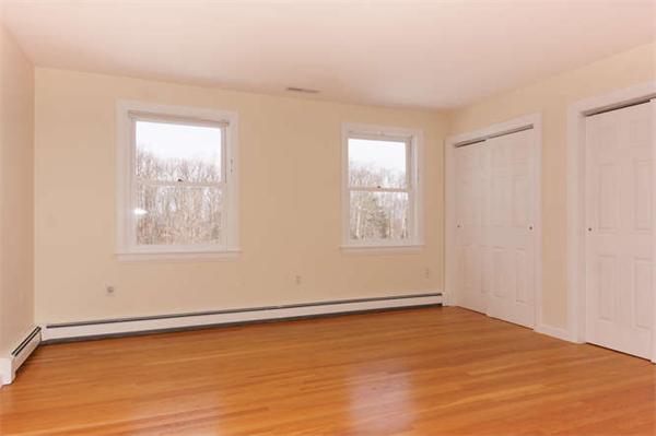 231 Old Littleton Road Harvard, MA 01451 - Photo 17 of 30 an empty room with wooden floor and windows