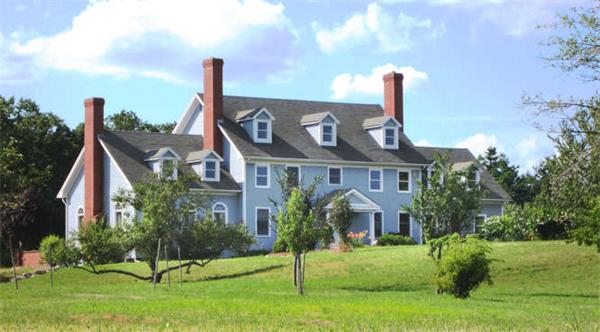 231 Old Littleton Road Harvard, MA 01451 - Photo 26 of 30 a front view of a house with a garden