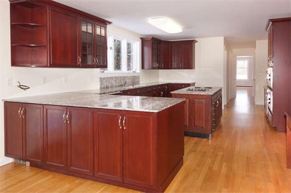 231 Old Littleton Road Harvard, MA 01451 - Photo 8 of 30 a kitchen with granite countertop wooden cabinets a sink and a stove