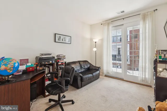 a livingroom with a workspace