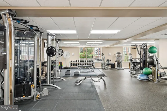a view of a tall building next to a road
