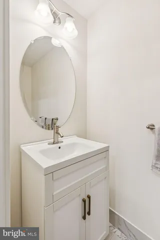 a bathroom with a sink and mirror