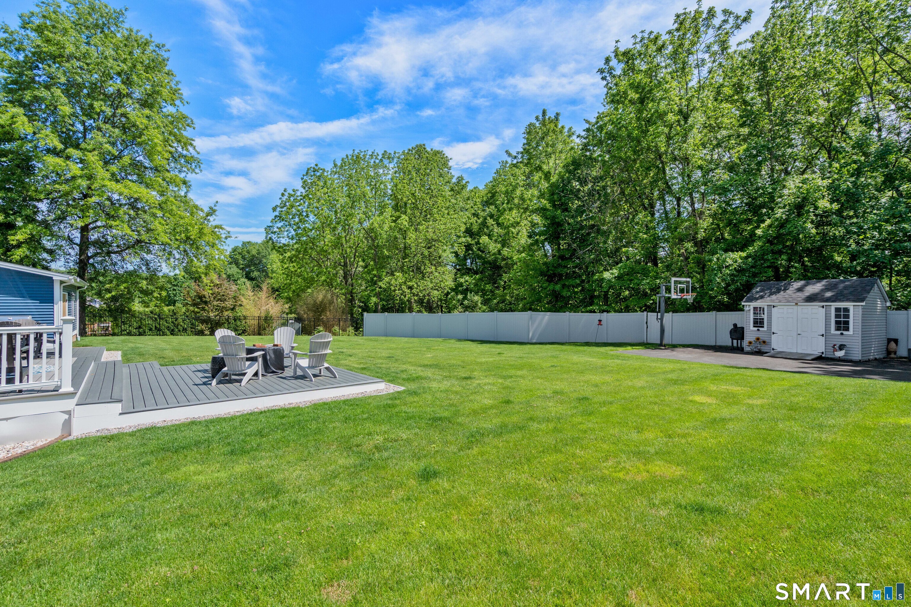 5 Limric Lane Suffield, CT 06078 - Photo 30 of 36 a view of a backyard with sitting area