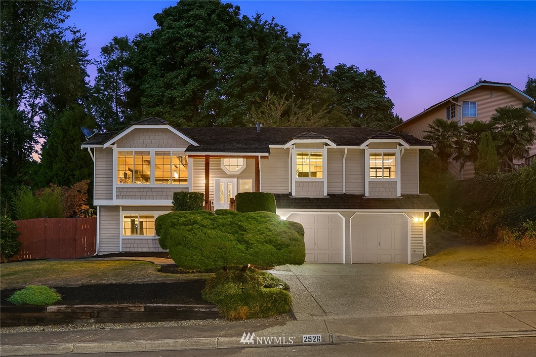 2526 Mill Avenue South Renton, WA 98055 - Photo 1 of 33 a front view of a house with garden