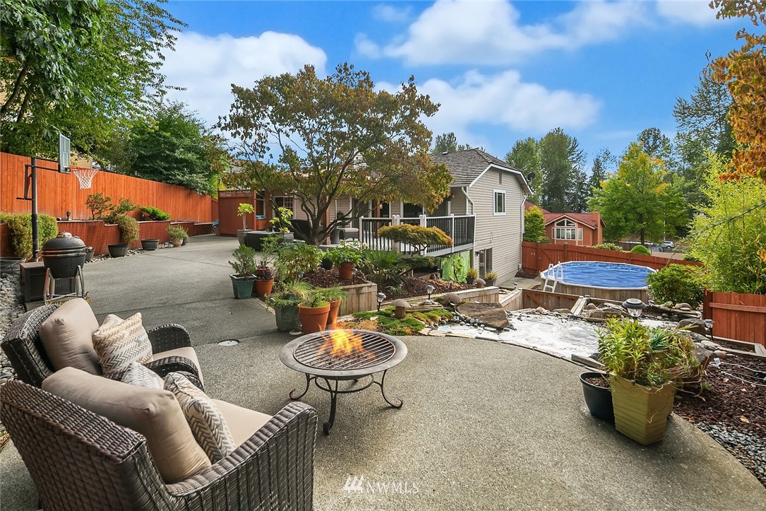 2526 Mill Avenue South Renton, WA 98055 - Photo 20 of 33 a view of a patio with couches and table and chairs and potted plants