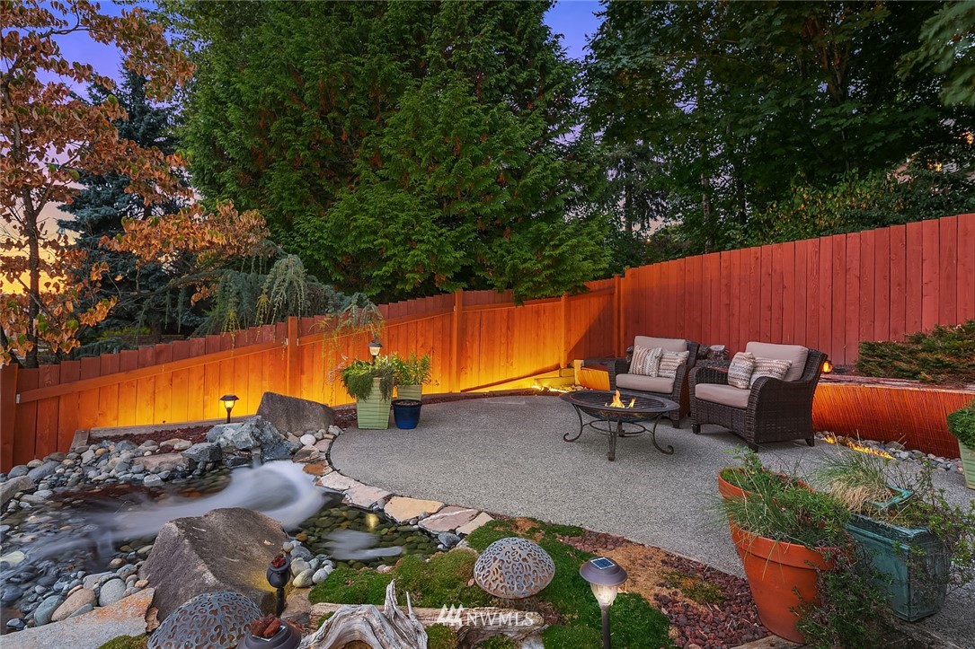 2526 Mill Avenue South Renton, WA 98055 - Photo 24 of 33 an outdoor sitting area with blue umbrella