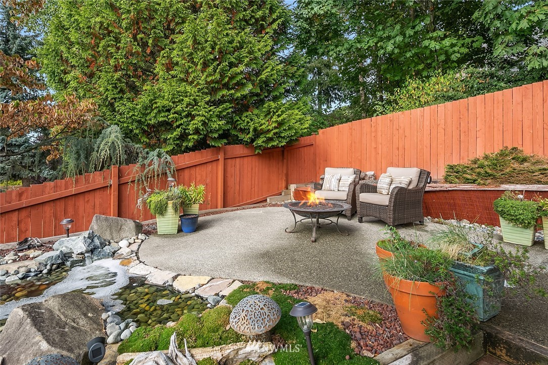2526 Mill Avenue South Renton, WA 98055 - Photo 29 of 33 a backyard of a house with outdoor seating