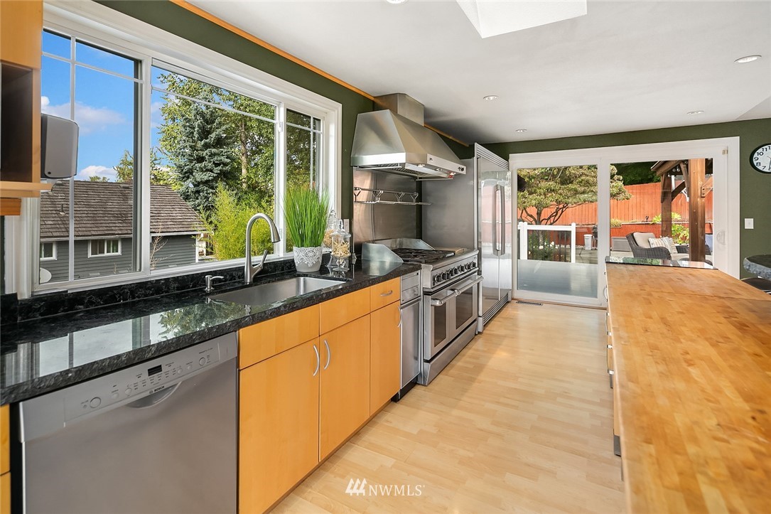 2526 Mill Avenue South Renton, WA 98055 - Photo 5 of 33 a large kitchen with stainless steel appliances a large window and counter space