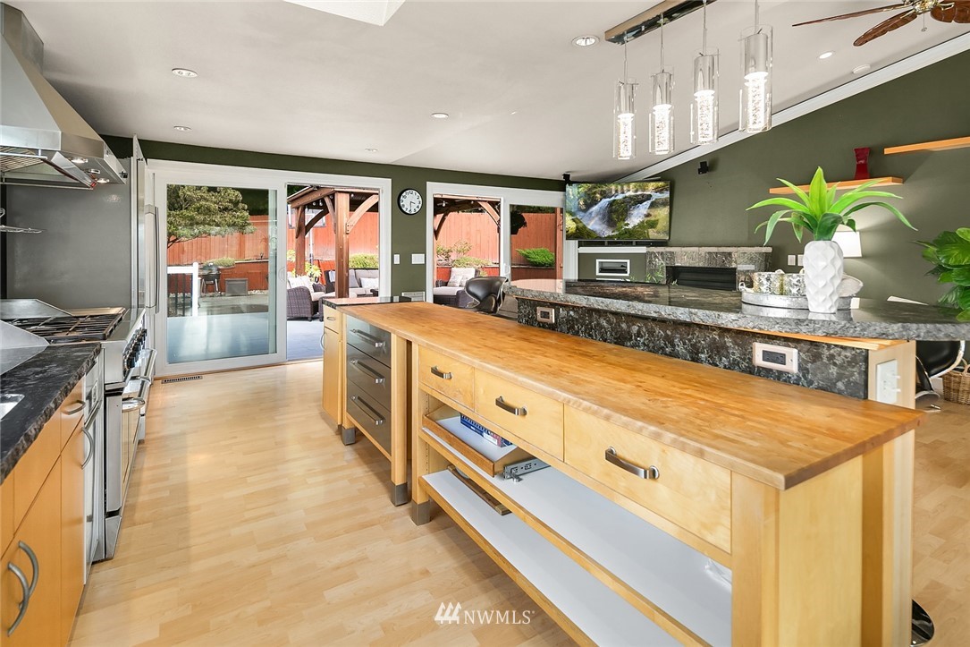 2526 Mill Avenue South Renton, WA 98055 - Photo 6 of 33 a large kitchen with stainless steel appliances granite countertop a large stove a sink and a refrigerator
