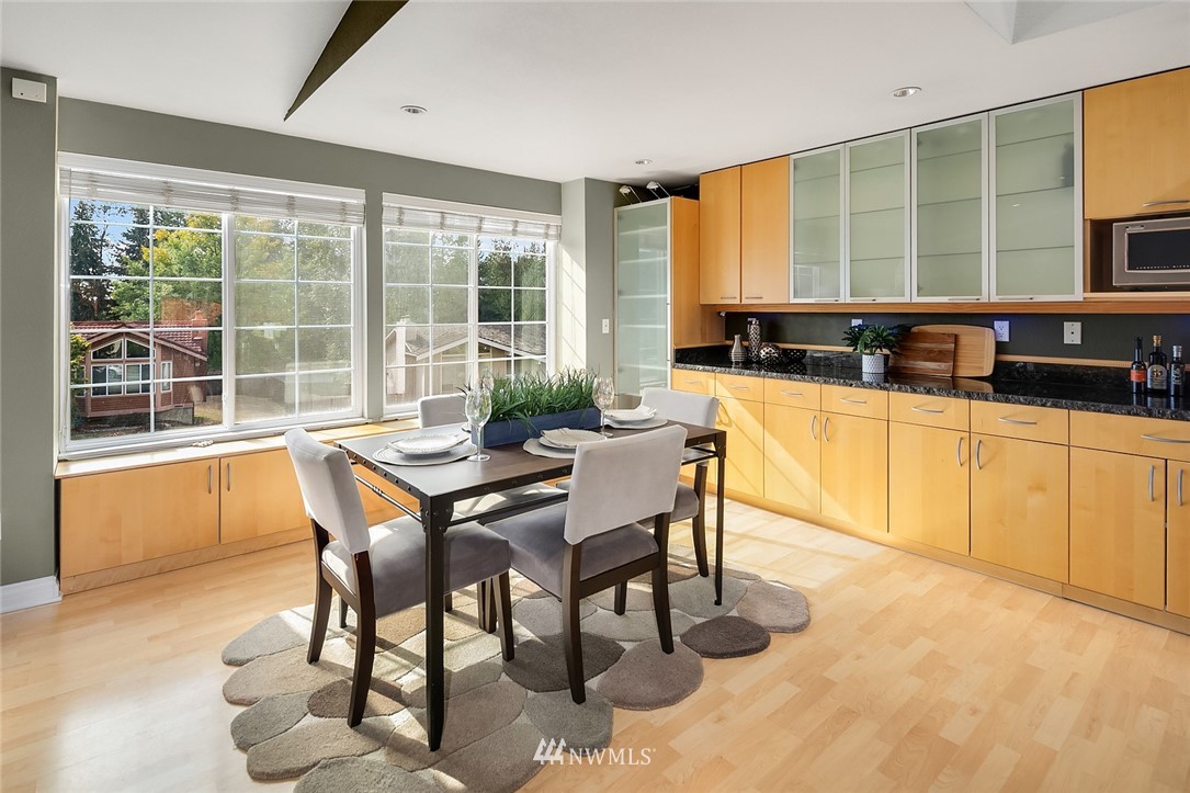 2526 Mill Avenue South Renton, WA 98055 - Photo 7 of 33 a dining room with furniture and wooden floor