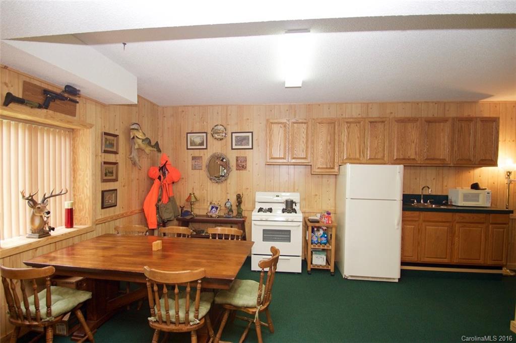 2005 Clontz Long Road Monroe, NC 28110 - Photo 11 of 24 a view of a dining room with furniture and a refrigerator
