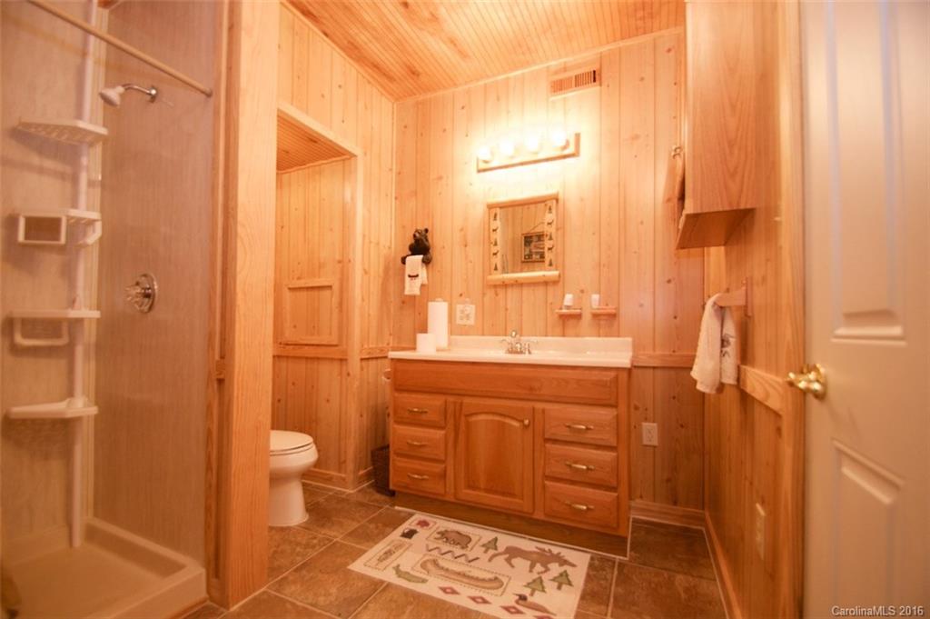 2005 Clontz Long Road Monroe, NC 28110 - Photo 14 of 24 a bathroom with a double vanity sink a toilet and shower