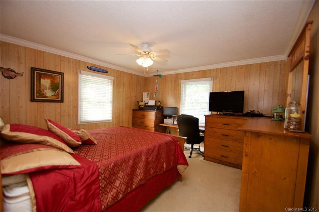 2005 Clontz Long Road Monroe, NC 28110 - Photo 15 of 24 a bedroom with a bed and a flat screen tv
