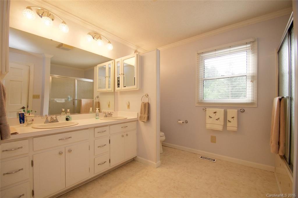 2005 Clontz Long Road Monroe, NC 28110 - Photo 18 of 24 a spacious bathroom with a double vanity sink and mirror