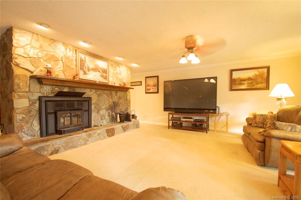 2005 Clontz Long Road Monroe, NC 28110 - Photo 5 of 24 a living room with fireplace furniture and a flat screen tv