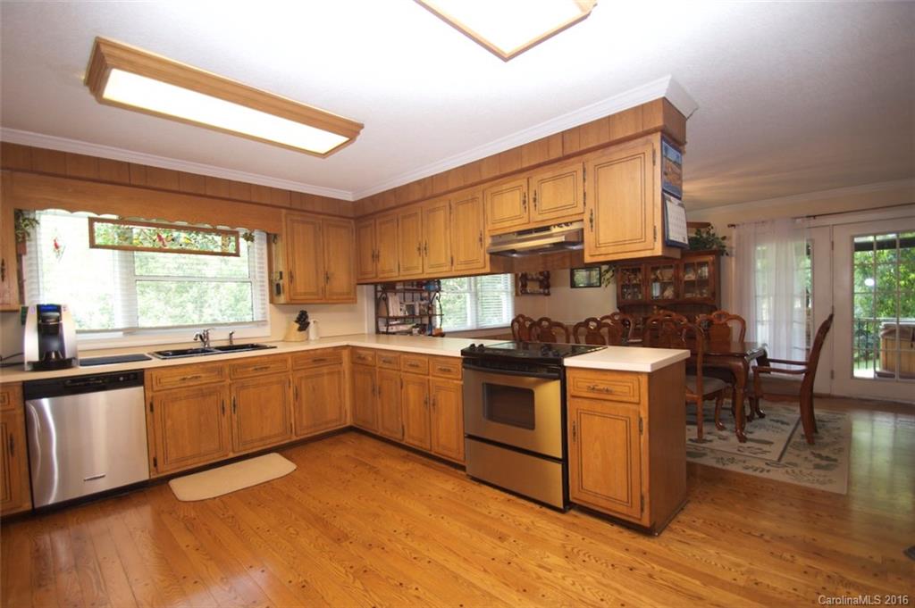 2005 Clontz Long Road Monroe, NC 28110 - Photo 6 of 24 a kitchen with stainless steel appliances granite countertop a stove a sink and a microwave