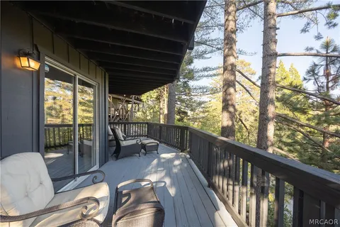 a view of a balcony with wooden floor