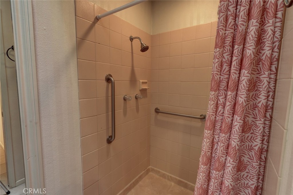 8566 Larkhall Circle, Unit 808A Huntington Beach, CA 92646 - Photo 20 of 46 a bathroom with a shower