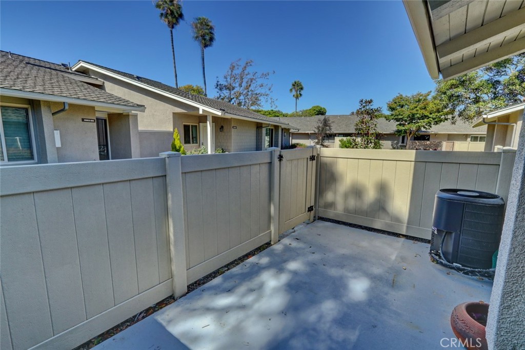 8566 Larkhall Circle, Unit 808A Huntington Beach, CA 92646 - Photo 22 of 46 a view of a house with a backyard