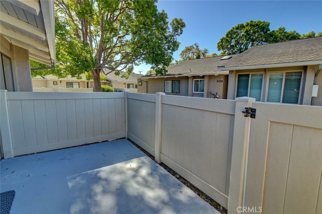 8566 Larkhall Circle, Unit 808A Huntington Beach, CA 92646 - Photo 23 of 46 a view of a house with a backyard
