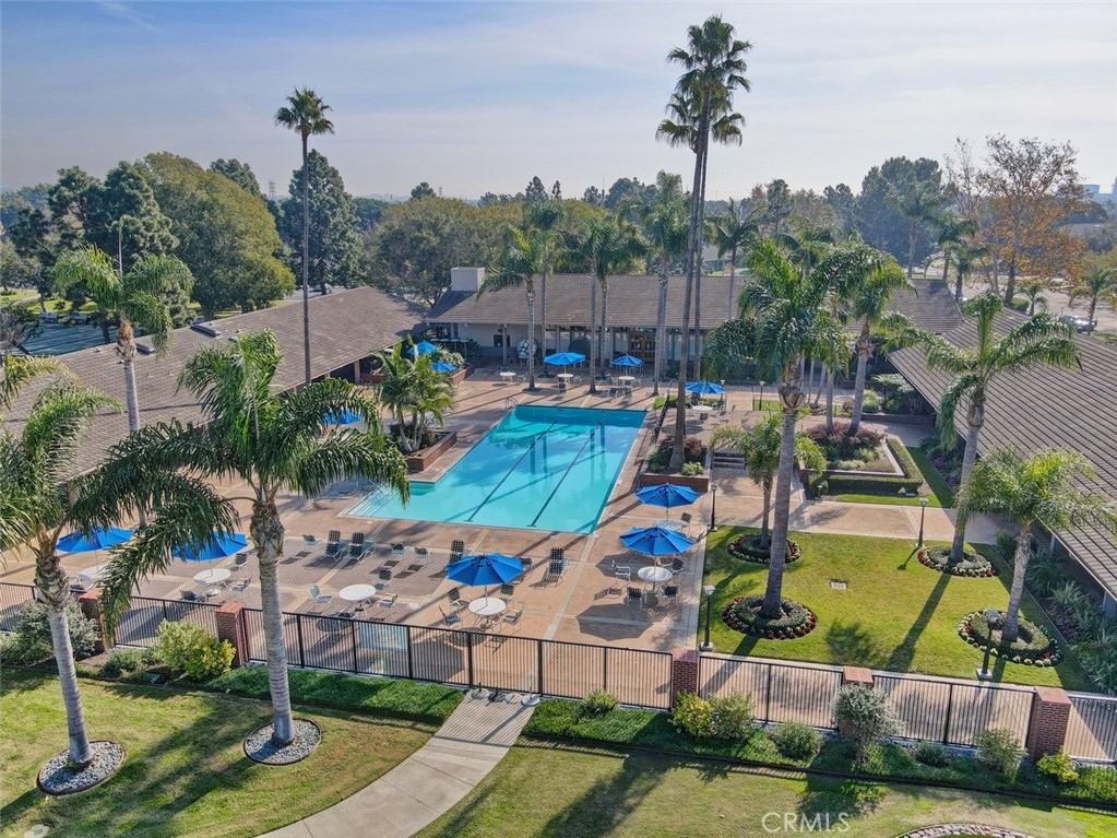 8566 Larkhall Circle, Unit 808A Huntington Beach, CA 92646 - Photo 32 of 46 an aerial view of a house with a garden and swimming pool