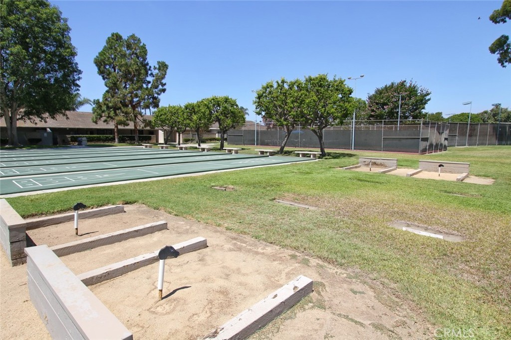 8566 Larkhall Circle, Unit 808A Huntington Beach, CA 92646 - Photo 44 of 46 a view of a swimming pool with a chair