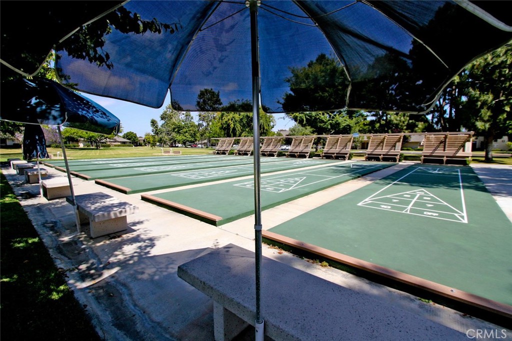 8566 Larkhall Circle, Unit 808A Huntington Beach, CA 92646 - Photo 46 of 46 a view of a patio with a table chairs and a patio